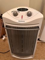 Front view of Holmes electric space heater showing controls and grille