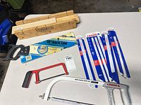 Overview showing mitre box, back saw, hacksaw frames, and blade packs