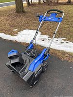 Full view of snow blower front and handle