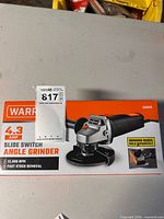 Front of sealed Warrior angle grinder box showing specs