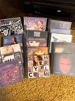 All 15 music CDs displayed with cover art visible