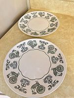 Two Taylorstone Summer Morn dinner plates with rooster decor