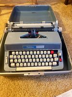 Top view of Wards Signature 5100 typewriter secured in its open case