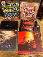 Group shot of all eight album covers displayed