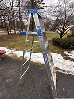 Full view of Werner 6-ft aluminum step ladder standing open