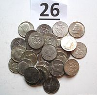 Pile view of mixed Kennedy half dollars