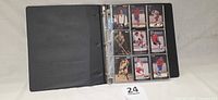 Binder open showing nine front-facing Star Pics hockey cards