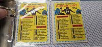 Two Topps Football checklist cards in plastic sleeves