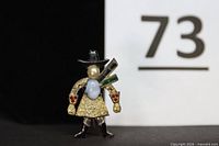 Front view of cowgirl brooch showing enamel colours, moonstone, pearl, rhinestones