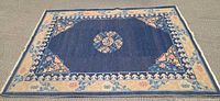 Full view of indigo floral wool rug