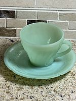 jadeite cup on saucer angled view