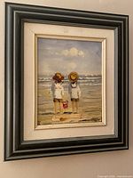 Full frontal view of framed painting showing subject and frame