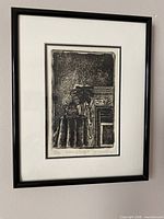 Framed lithograph on wall