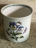 Front view showing Viola hybrida print and rim border