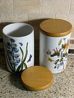 Both Portmeirion Botanic Garden canisters with lids displayed, showing size and style
