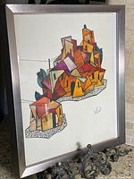 Framed artwork angled view showing composition and frame