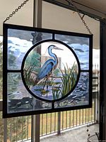 Front view of stained glass panel showing heron motif and full frame