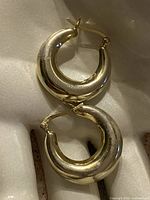 front view of both chunky sterling hoops showing shape and latch