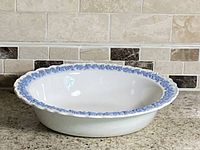 Top angle of oval bowl showing interior and blue relief rim