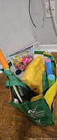 Bag with assorted water toys, balloons, blanket, flying disc