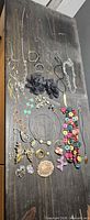 All jewelry pieces laid out on dark surface