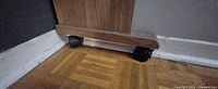 Caster wheel under desk stretcher