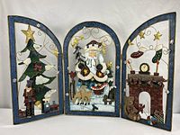 Full view of three-panel Christmas fireplace screen