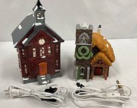 Front view of both buildings with cords and bulbs