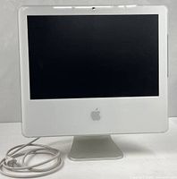 Front view of Apple iMac G5 showing screen, bezel, and Apple logo