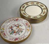 Two patterns shown: one Johnson Bros plate in foreground, stack of Minton plates to right