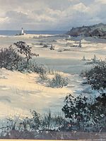 Close-up of artwork showing dunes, vegetation and lighthouse