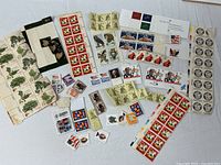 Overview of assorted panes, blocks, strips and singles of U.S. postage stamps