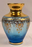 Front view of pale blue and gold Murano vase