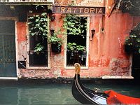 Close view of print detailing Trattoria sign and gondola prow