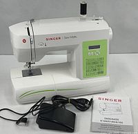 Front view of Singer Sew Mate 5400 with foot pedal, cord and manual