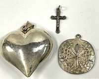 Three sterling silver pendants heart, crucifix, sand dollar