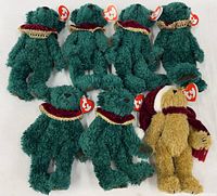 Group of six green Laurel bears and one tan Jangles bear with tags
