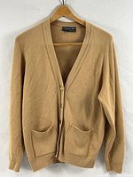 Full front view of camel Straven cardigan on hanger
