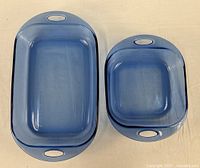 Top view of both cobalt blue casserole dishes showing sizes and handles