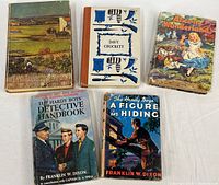 Group shot of five vintage books showing covers