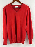 Front view of red cashmere V-neck sweater on hanger