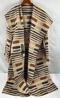 Full view of open-front wool coat showing length, pattern and toggle