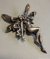 full view of sterling silver seated fairy pendant