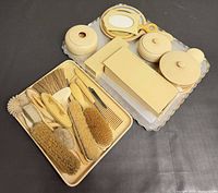 Complete French Ivory celluloid vanity set arranged on surface