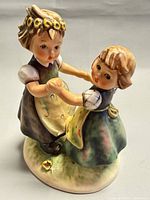 Front view of Goebel Hummel Spring Dance figurine