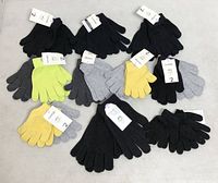 All 20 pairs of assorted knit gloves laid out to show colours and tags