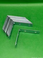 Stack and single view of right-angle zinc braces showing quantity and design