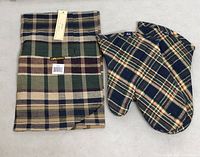 folded plaid apron and matching oven mitt pair