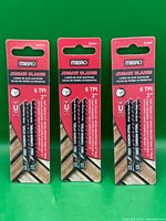 Front view of three sealed twin-packs of Mibro 3" 6-TPI jigsaw blades