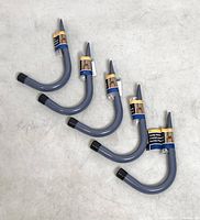 Group of five Stinson grey J-hooks with labels